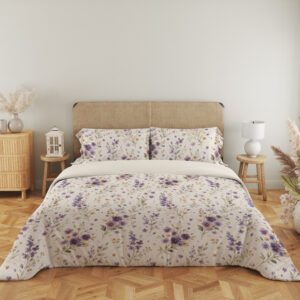 Full front view of ivory bedding with scattered purple and lavender pansies, small yellow flowers and delicate gray-green leafy stems beneath a beige headboard.
