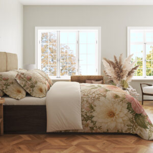 Side view of ivory bedding with large blush-pink and peach flowers, cream blooms, airy white flower clusters and soft green leaves, showing the print across the draped cover.