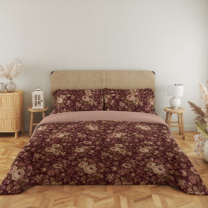 Full front view of burgundy bedding with densely scattered cream and dusty-pink roses, tiny blossoms and muted olive leaves beneath a beige headboard.