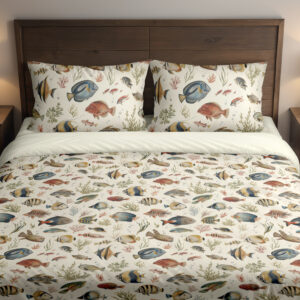 Front close view of ivory bedding with small watercolor reef fish in blue, yellow, coral and gray swimming among delicate sea plants on the cover and matching pillows.