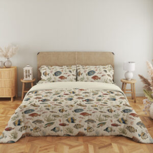 Full front view of ivory bedding with small watercolor reef fish in blue, yellow, coral and gray swimming among delicate sea plants beneath a beige headboard.