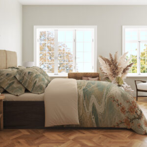 Side view of crane-print bedding, showing pale teal waves and rust-colored flowering branches on the draped cover.