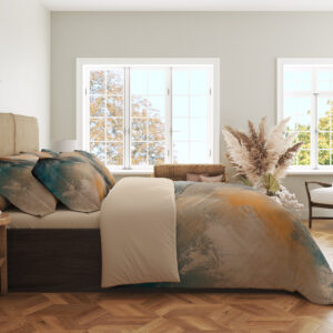 Side view of bedding printed with sweeping abstract brushstrokes in teal, burnt orange, charcoal, cream and warm gray, showing the print across the draped cover.