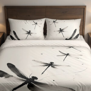 Front close view of ivory bedding printed with large black and gray dragonflies, fine curving lines and scattered ink-like dots on the cover and matching pillows.
