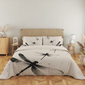 Full front view of ivory bedding printed with large black and gray dragonflies, fine curving lines and scattered ink-like dots beneath a beige headboard.
