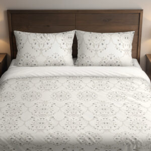 Front close view of ivory bedding with pale-gray floral medallions, tiny dotted flowers and fine scalloped lace-like printed borders on the cover and matching pillows.