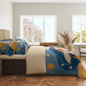 Side view of blue bedding printed with orange, black and white koi, circular ripples, mustard lily pads and flowing cream and pink shapes, showing the print across the draped cover.