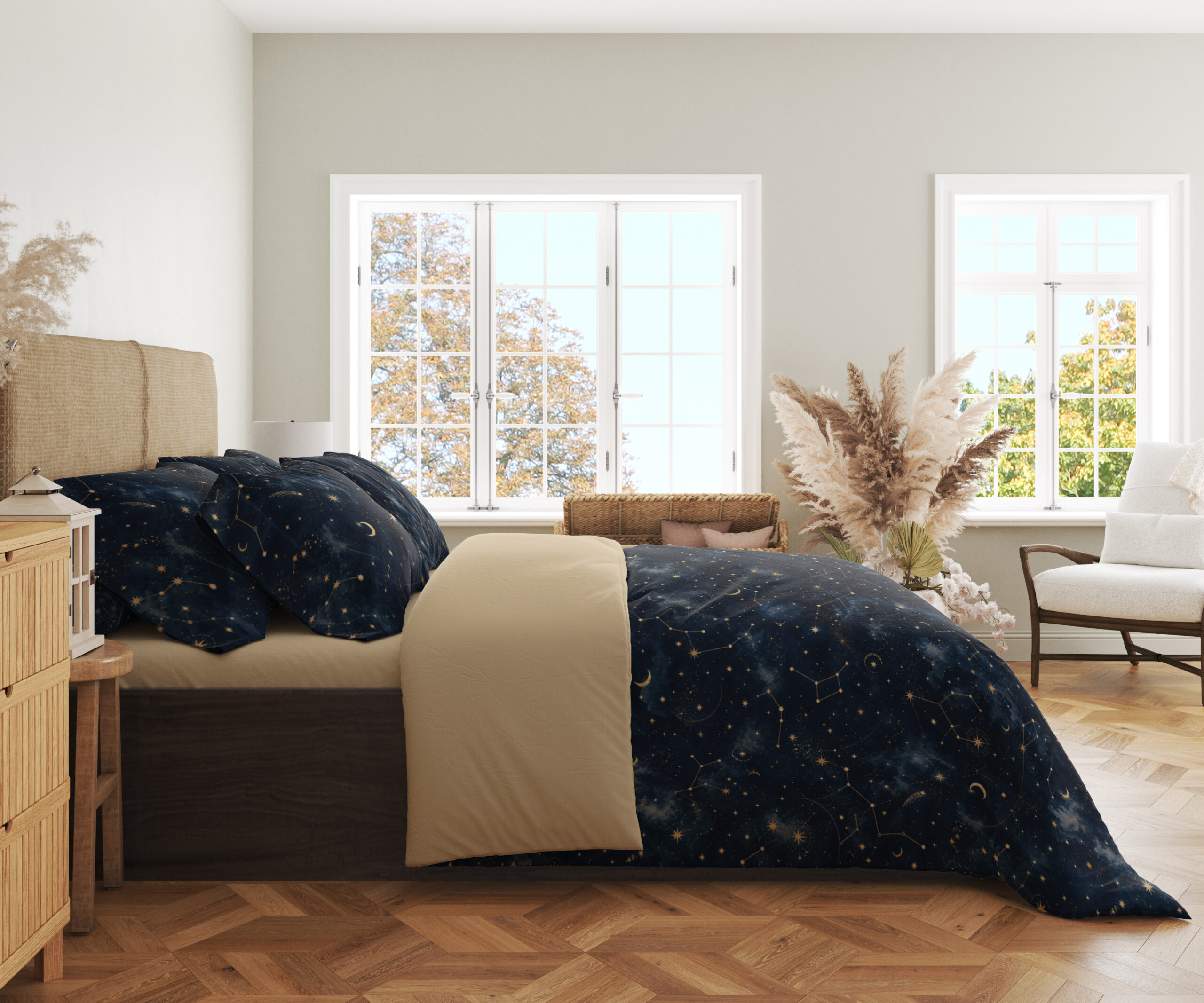 Side view of deep navy bedding with tiny pale stars, fine constellation lines, crescent moons and soft blue nebula-like patches, showing the print across the draped cover.