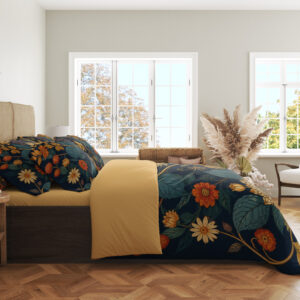 Side view of navy floral bedding, showing small cream and orange flowers, ochre stems and broad teal leaves on the draped cover.