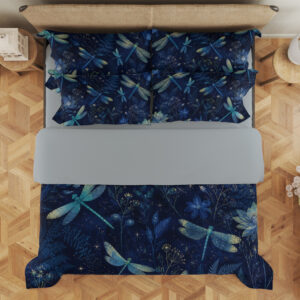 Overhead view of navy bedding printed with turquoise and pale green dragonflies among blue flowers and fine botanical sprigs, with the design repeated on the pillows.