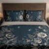 Front close view of deep teal bedding with fine ivory line drawings of open flowers, spiky seed heads, fern-like leaves and tiny floating seeds on the cover and matching pillows.