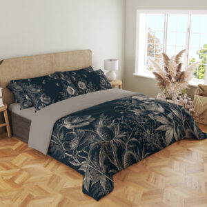 Angled full-bed view of deep teal bedding with fine ivory line drawings of open flowers, spiky seed heads, fern-like leaves and tiny floating seeds, showing the pattern across the cover and pillows.