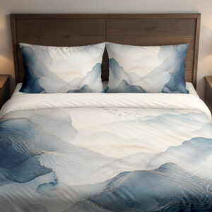 Front close view of bedding printed with layered misty blue and gray watercolor contours, fine pale lines and an open ivory center on the cover and matching pillows.