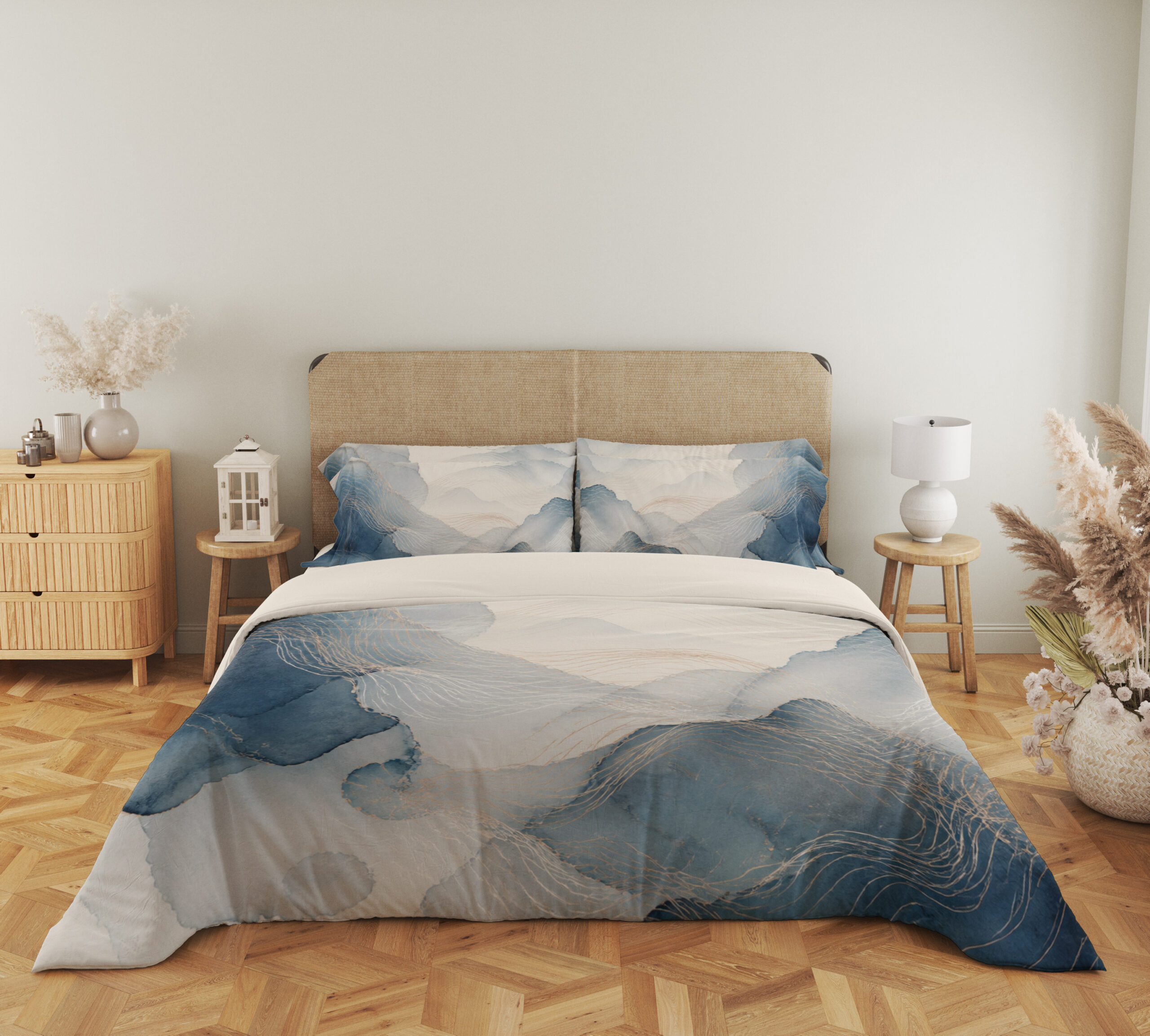Full front view of bedding printed with layered misty blue and gray watercolor contours, fine pale lines and an open ivory center beneath a beige headboard.