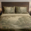 Front close view of muted sage-and-cream bedding with a wooded river landscape, layered trees, distant hills and small pink flowers along the banks on the cover and matching pillows.