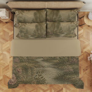 Overhead view of muted sage-and-cream bedding with a wooded river landscape, layered trees, distant hills and small pink flowers along the banks, with the design repeated on the pillows.