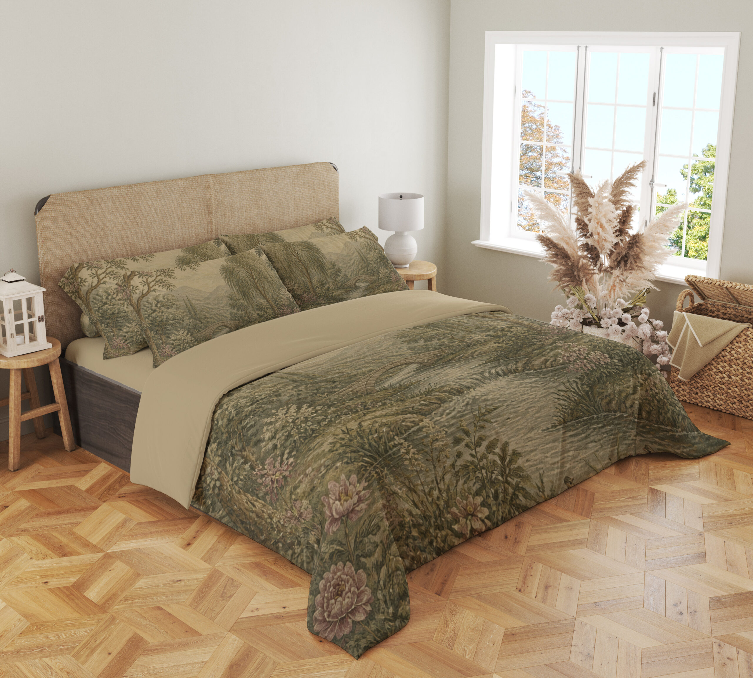 Angled full-bed view of muted sage-and-cream bedding with a wooded river landscape, layered trees, distant hills and small pink flowers along the banks, showing the pattern across the cover and pillows.