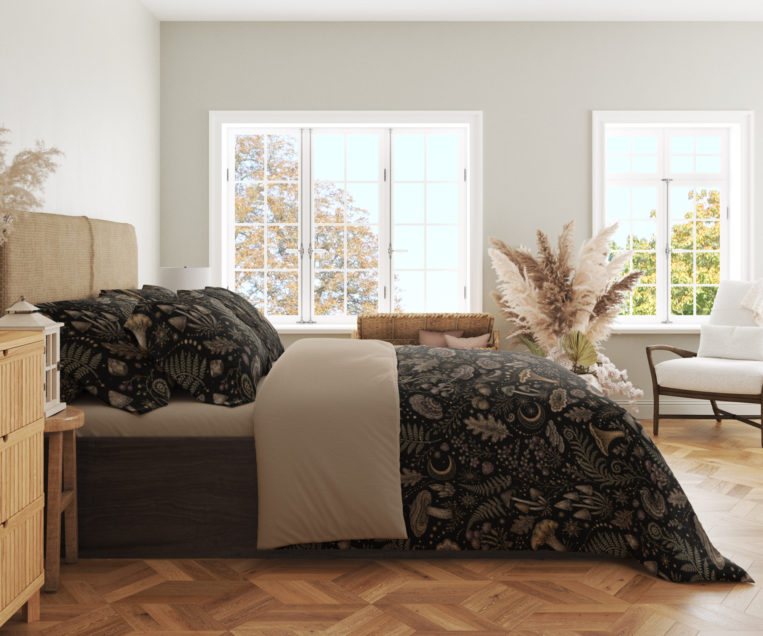 Side view of charcoal bedding printed with a dense repeat of taupe mushrooms, fern fronds, leaves and small woodland flowers, showing the print across the draped cover.