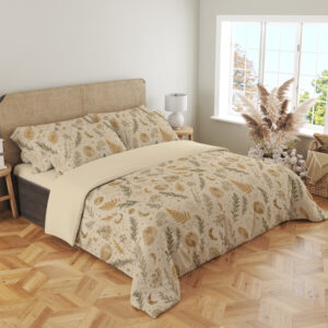 Angled full-bed view of ivory bedding with small ochre fern fronds, muted green leafy sprigs, pale flowers and tiny crescent moons, showing the pattern across the cover and pillows.