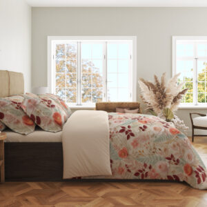 Side view of ivory bedding with a dense delicate repeat of coral-pink roses, burgundy leaves, pale teal foliage and tiny peach blossoms, showing the print across the draped cover.