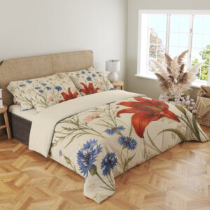 Angled full-bed view of cream bedding printed with large red lilies, blue cornflowers and fine green meadow stems, showing the pattern across the cover and pillows.