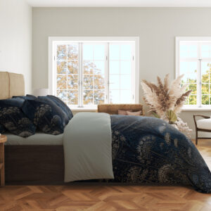 Side view of midnight-blue bedding with delicate pale umbel flowers and fine meadow stems beneath a softly glowing star-speckled sky, showing the print across the draped cover.
