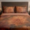 Front close view of terracotta bedding with large softly painted orange dahlias, muted burgundy petals and shadowy olive leaves on the cover and matching pillows.
