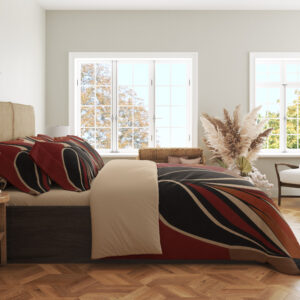 Side view of stylized crane bedding, showing sweeping black, rust-red and cream wing shapes on the draped cover.