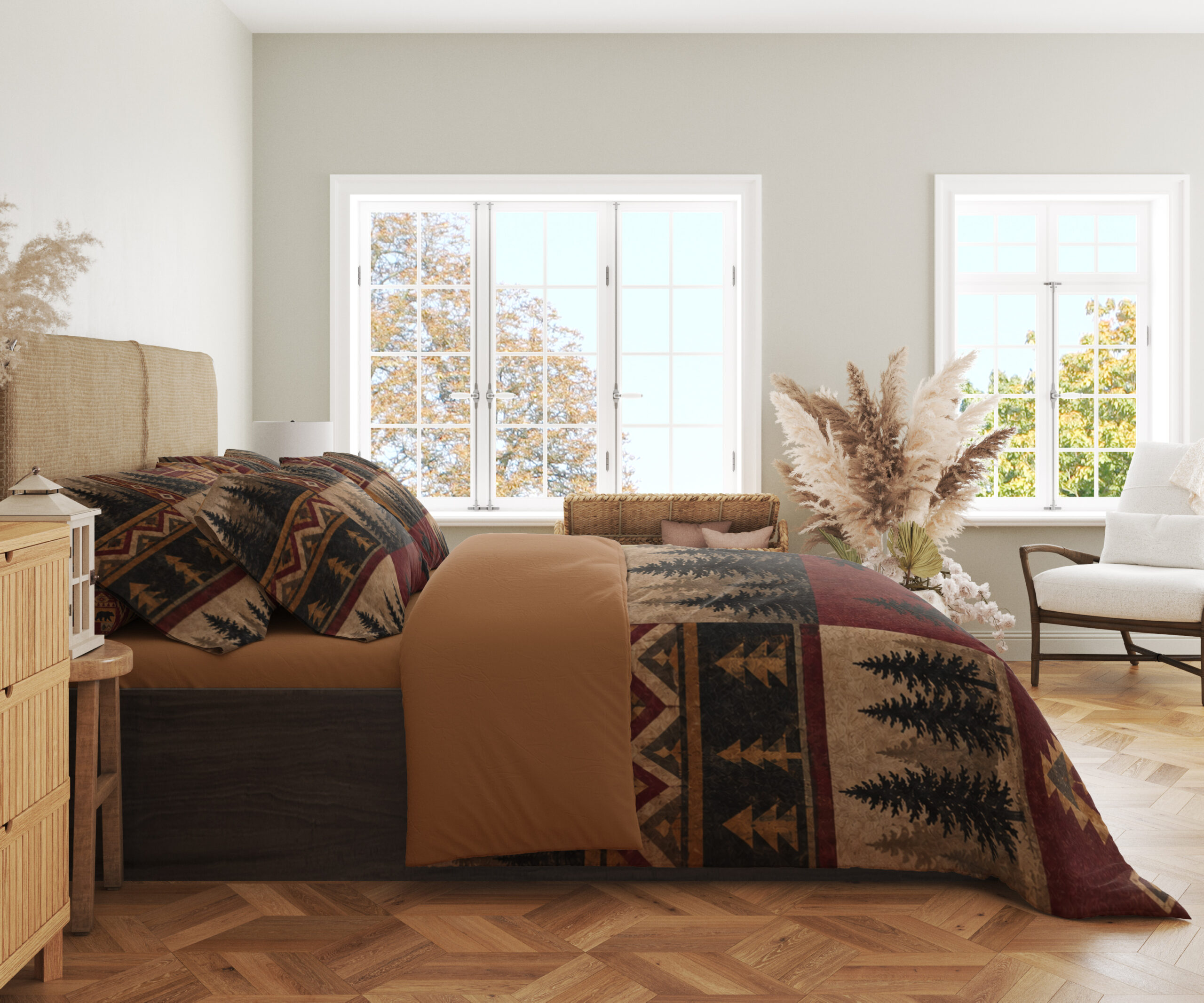 Side view of woodland patchwork bedding, showing black pine trees and ochre geometric bands on burgundy and tan panels.