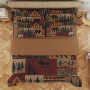 Overhead view of bedding printed with burgundy, ochre and tan patchwork panels of black bears, moose, pine trees and geometric borders, with the design repeated on the pillows.
