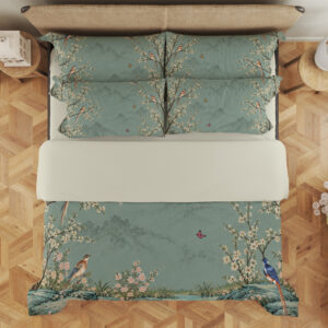 Celadon Blossom Aviary Bedding Set with celadon birds and cream blossoms — overhead view showing the bedding layout