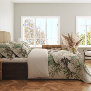 Side view of narcissus landscape bedding, showing dark mossy rocks and long sage-green leaves on the draped cover.