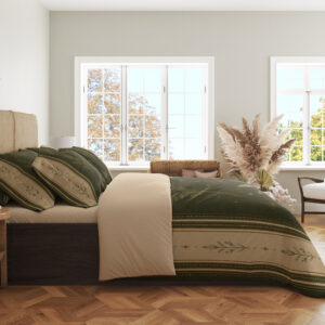 Side view of olive botanical bedding, showing the cream border with a small leafy sprig motif across the draped edge.