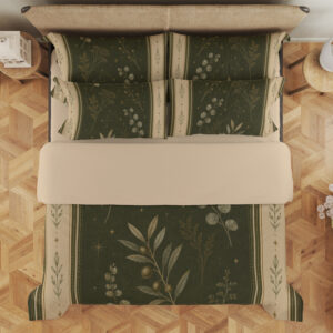 Overhead view of olive bedding printed with pale botanical sprigs and tiny star-like marks, framed by cream borders with small leaf motifs, with the design repeated on the pillows.