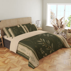 Angled full-bed view of olive bedding printed with pale botanical sprigs and tiny star-like marks, framed by cream borders with small leaf motifs, showing the pattern across the cover and pillows.