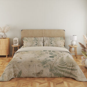 Full front view of parchment bedding printed with sage fern fronds, round eucalyptus-like leaves, delicate grasses and small moth motifs beneath a beige headboard.
