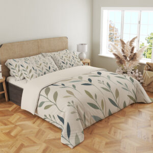 Angled full-bed view of ivory bedding with slender upright stems and simple pointed leaves in muted teal, sage and olive, showing the pattern across the cover and pillows.