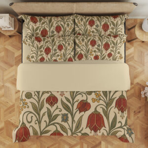 Overhead view of cream bedding printed with scarlet drooping bell-shaped flowers, small yellow berries and curling olive-green vines, with the design repeated on the pillows.