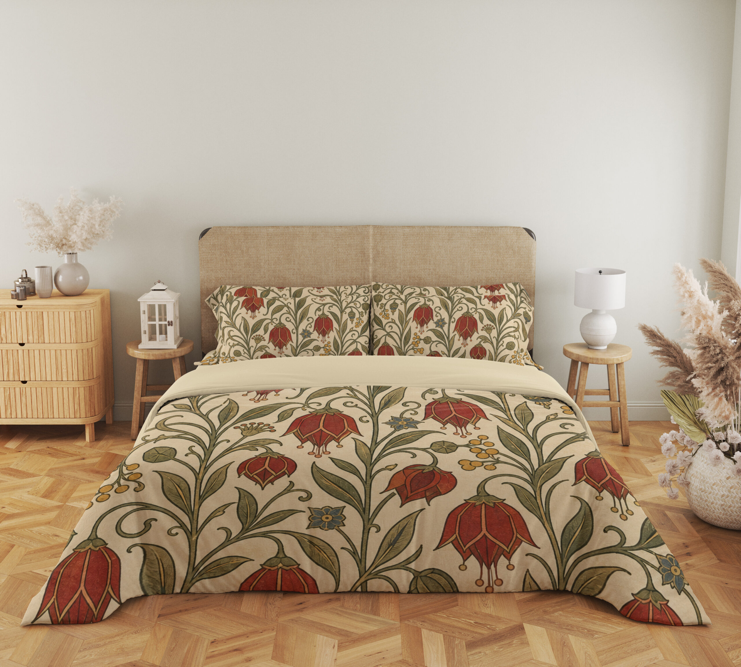 Full front view of cream bedding printed with scarlet drooping bell-shaped flowers, small yellow berries and curling olive-green vines beneath a beige headboard.