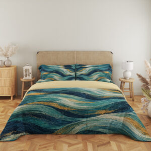 Front view of Teal Gilded Current bedding against a beige headboard, with layered navy and aqua waves and fine gold-colored lines.