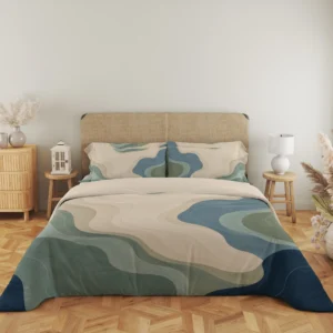 Wide front view of cream, sage and blue-gray contour fields with navy corners on the duvet cover and matching pillows, beside a lantern and lamp.