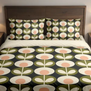 Charcoal bedding with cream flowers, peach centers and olive leaf medallions across the duvet and pillows, shown close up from the front.