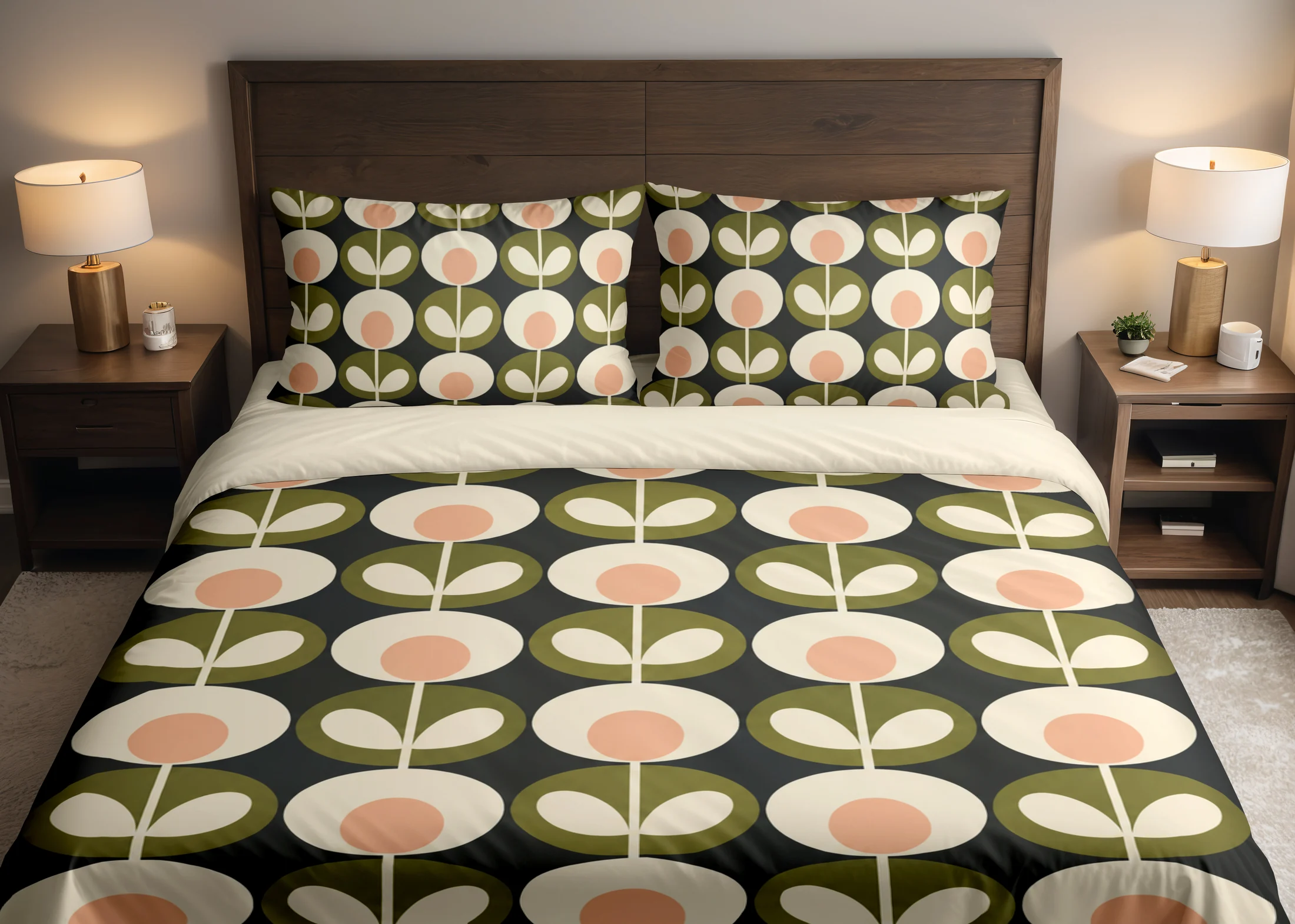 Charcoal bedding with cream flowers, peach centers and olive leaf medallions across the duvet and pillows, shown close up from the front.
