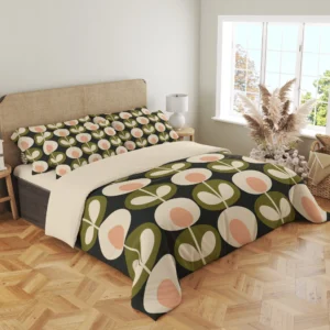 Angled view of peach-centered flowers and olive leaf medallions on a charcoal duvet, with a large flower curving around the draped front corner.