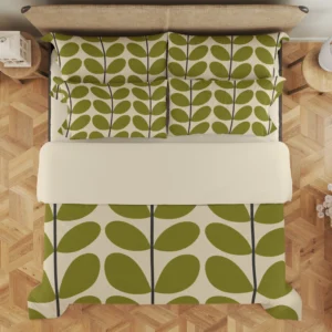 Overhead view of ivory bedding with olive paired leaves on dark vertical stems, patterned pillows above a broad plain folded section.