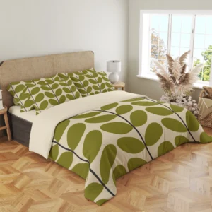Angled view of large olive leaves on an ivory duvet, with charcoal stems sweeping over the top and draped front corner.