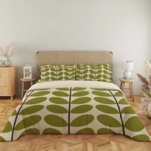 Full front view of ivory bedding showing tall charcoal stems and paired olive leaves across the duvet, with matching pillows above a cream fold.