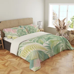 Three-quarter view of sage split leaves, blush tropical foliage and pale yellow fronds on a cream duvet cover and matching pillows beside a window.