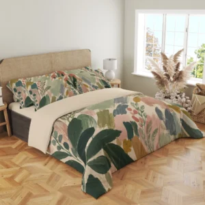 Three-quarter bedroom view of sage and blush brushstroke bedding, with dark green leaves draping over the front corner beside a woven headboard.